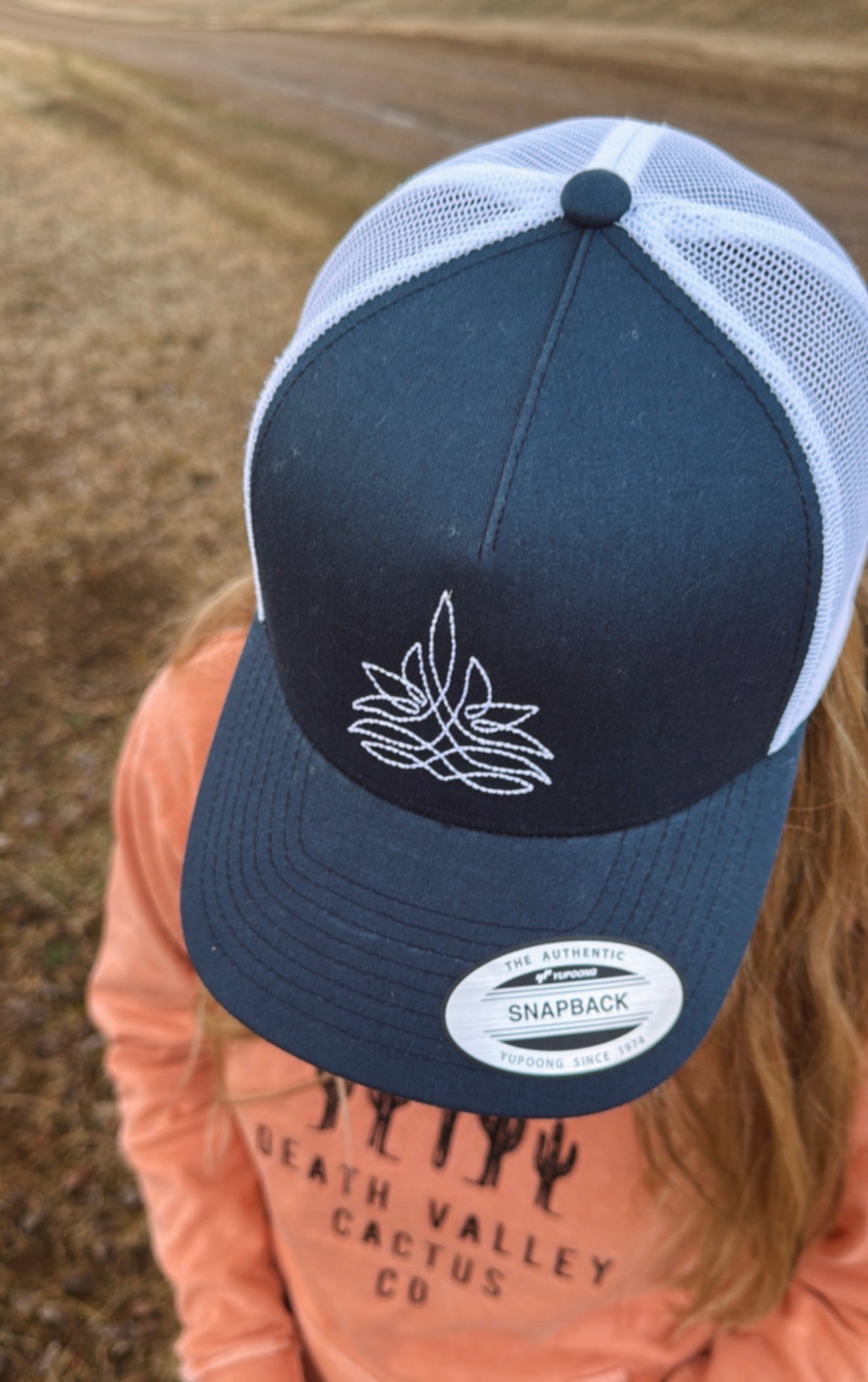 White Boot Stitch On A Navy Hat